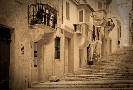 Retro photo of old picturesque street of Valletta. Maltaの写真素材