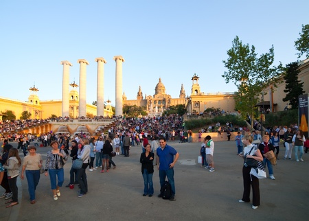 BARCELONA, SPAIN - APRIL 9: People walking Square of Spain in April 9, 2011 in Barcelona, Spain.  Square of Spain at Montjuic in duskのeditorial素材