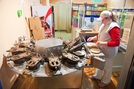 KARLOVY VARY, CZECHIA - NOVEMBER 24:  Baker is making Karlovarske oplatky on November 24, 2011 in Bohemia, Czechia.Karlovarske oplatky is traditional  Czech waffle, but The European Committee for Trademark refuses to recognize the のeditorial素材