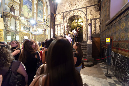SANTA MARIA DE MONTSERRAT, SPAIN - 9 APRIL: Worshipers during worship in church on April 9,...