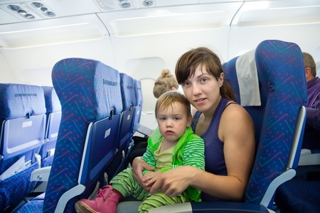 women with child in the airplane cabinのeditorial素材
