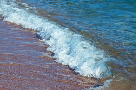 Surface of sea wave on sand beachの写真素材