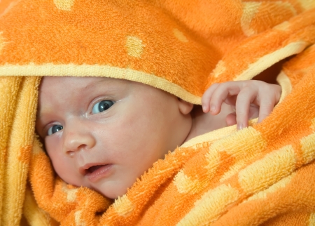 New born baby wrapped in warm blanket.の写真素材