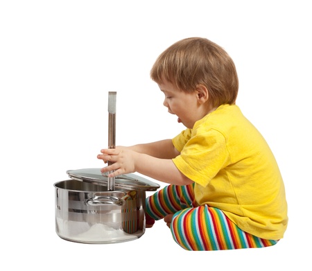 Baby cook with  pan. Isolated over white backgroundの写真素材