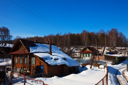Wooden houses in winter street at Vyazniki. Russiaのeditorial素材