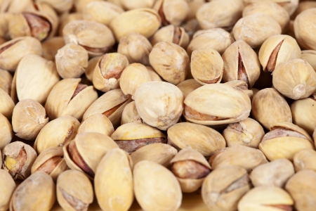 Background of ripe whole pistachios. Shallow DOFの写真素材