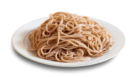 Buckwheat spaghetti pasta  in plate over white background with shade