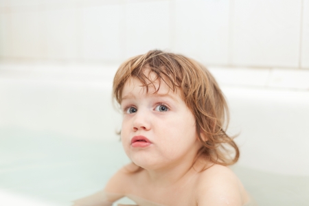 two-year child bathes  in bathの写真素材