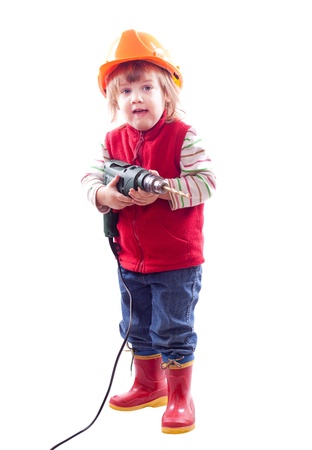 2 years baby in hardhat with drill. Isolated over white の写真素材