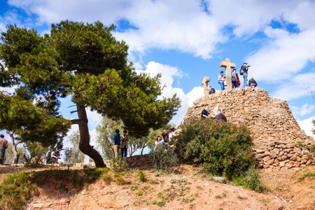 BARCELONA, SPAIN - MARCH 12: Calvary in Park Guell in March 12, 2013 in Barcelona, Spain. Park was designed by Gaudi and built in 1900 to 1914, it has an extension of 17.18 ha. Now it is city parkのeditorial素材