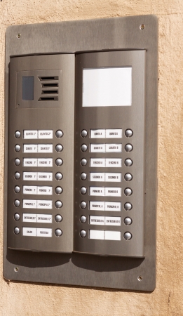 Close-up of building intercom with apartment numbersの写真素材