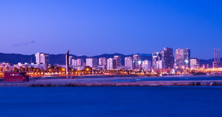 View of Barcelona from sea side in night. Catalonia, Spainのeditorial素材