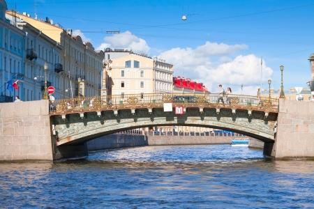 ST.PETERSBURG, RUSSIA - AUGUST 2: Bolshoi Koniushennyi bridge through Moyka River in August 2, 2012 in St.Petersburg, Russia. Single-span arch bridge made of iron tubing, built in 1828のeditorial素材