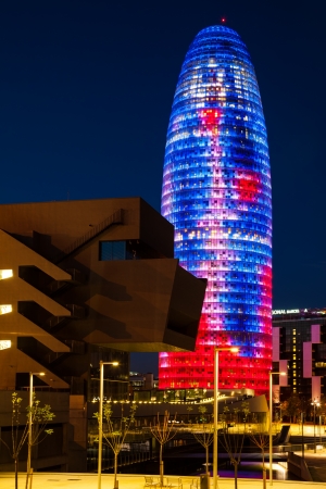 BARCELONA, SPAIN - APRIL 12: Torre agbar night in in April 12, 2013 in Barcelona, Spain. Skyscraper, built in 1999-2005 by Jean Nouvel. Now one of  symbols of Barcelona is owned by Grupo Agbarのeditorial素材