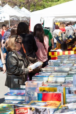 BARCELONA, SPAIN - APRIL 23: Sant Jordi feast in April 23, 2013 in Barcelona, Spain. Books and red roses during Sant Jordi is traditionally in festivals at Cataloniaのeditorial素材