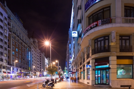 MADRID, SPAIN - APRIL 25: Night view of Gran Via from Spain Square in April 25, 2013 in Madrid, Spain. Gran Via one of broadest and most important avenues at cityのeditorial素材