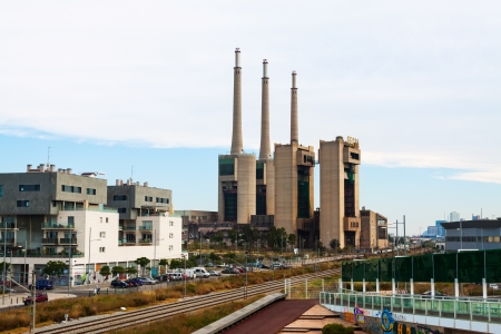 BARCELONA, SPAIN - JUNE 13: View of power station in Sand Adria de Besos in June 13, 2013 in Barcelona, Spain. Three chimneys of closed Besos power thermal station - one of symbols of Sand Adriaのeditorial素材
