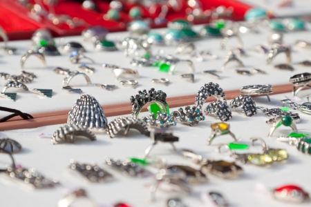 Rings on jewelry counter at store の写真素材