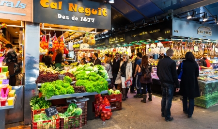 BARCELONA, SPAIN - MARCH 28: vendors at Boqueria market in March 28, 2013 in Barcelona, Spain. The market is famous for its variety of fresh produceのeditorial素材