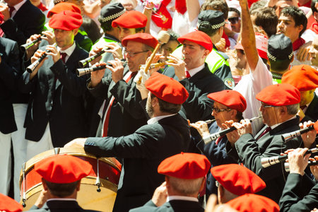 PAMPLONA, SPAIN - JULY 6: Begining of San Fermin feast in July 6, 2013 in Pamplona, Spain.Municipal Orchestra playing  at ayuntamiento squareのeditorial素材