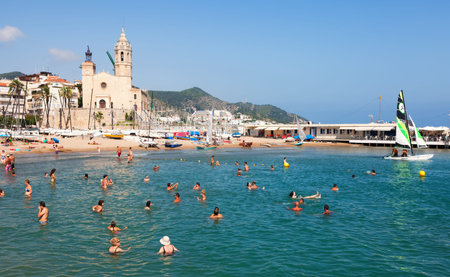 SITGES, SPAIN - AUGUST 6: Mediterranean resort in summertime in August 6, 2013 in Sitges, Spain. Town is known for its sandy  coastのeditorial素材