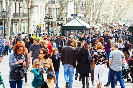 BARCELONA, SPAIN - MARCH 28: crowd of people  at La Rambla in March 28, 2013 in Barcelona, Spain. La Rambla one of symbol of city. Center of touristic lifeのeditorial素材