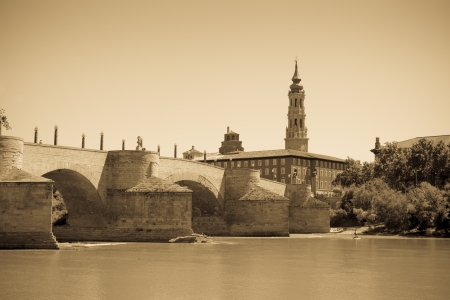 Retro photo of medieval bridge over Ebro river. Zaragoza, Aragonのeditorial素材