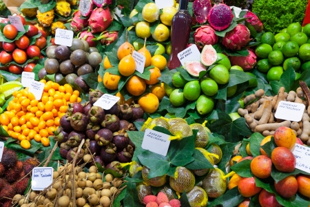 Exotic fruits and berries on the counter of  Spanish marketの写真素材