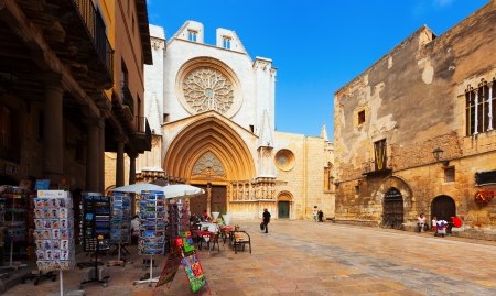 TARRAGONA, SPAIN - AUGUST 30: Tarragona Cathedral on August 30, 2013 in Tarragona, Spain. 
Retail sale of postcards with views on squareのeditorial素材
