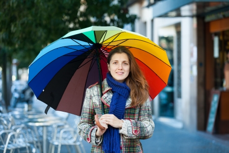 Portrait of beauty girl with umbrella  in autumn streetの写真素材