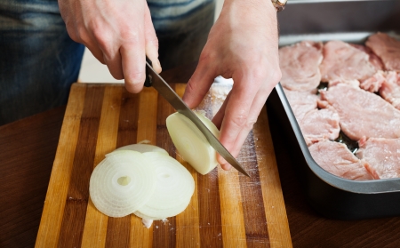  Steps of cooking  meat in roasting pan. Hands cutting onionの写真素材
