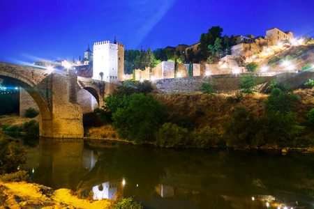 City fortifications from river in night. Toledo, Spainのeditorial素材