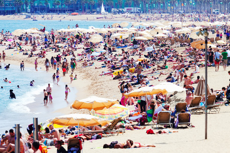 BARCELONA, SPAIN - JUNE 28: View of Barceloneta Beach in June 28, 2013 in Barcelona, Spain. It is one of the most popular beach in Europeのeditorial素材