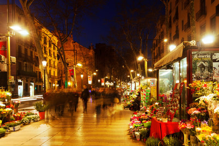  BARCELONA, SPAIN - MARCH 13, 2014: Flower kiosks on la Rambla in night. La Rambla one of symbol of...