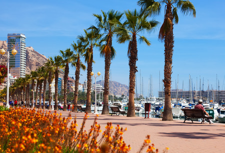  ALICANTE, SPAIN - APRIL 14, 2014: Embankment in Alicante. Avenue Admiral July Guillen Tato. Place for walking people at port sideのeditorial素材