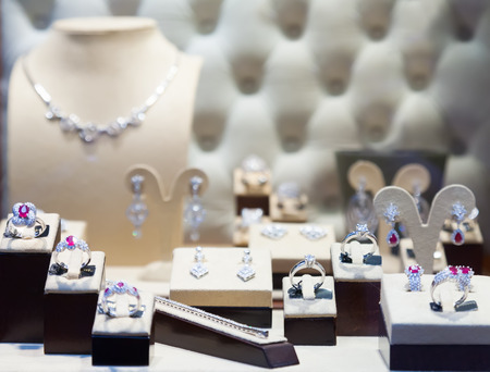 counter with silver jewelry at store windowの写真素材