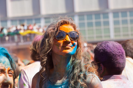 BARCELONA, SPAIN - APRIL 6, 2014: Woman in paint pigments  at IV Festival of colors Holi Barcelona