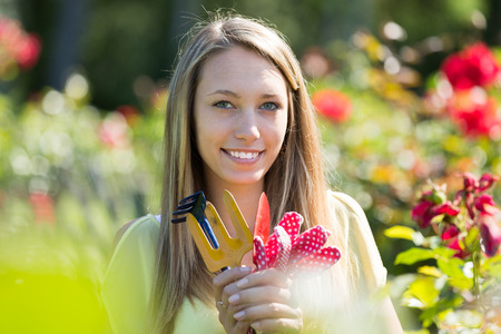 Casual female florist working in the gardenの写真素材