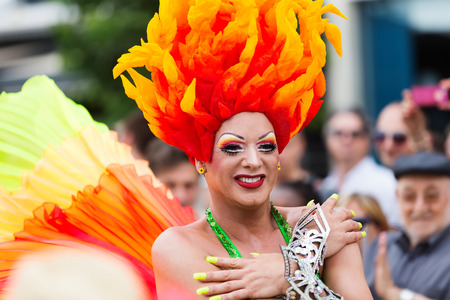 SITGES, SPAIN - JUNE 15, 2014: Unidentified person in plumage at Gay pride parade in Sitgesのeditorial素材