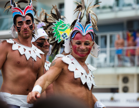 SITGES, SPAIN - JUNE 15, 2014: Unidentified guys dressed in plumage at Gay pride parade in Sitges. Cataloniaのeditorial素材