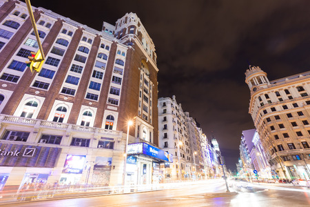 MADRID, SPAIN - APRIL 26: Wide angle shot of night street in April 26, 2013 in Madrid, Spain. Gran Via one of broadest and most important avenues at city and one of centre of nightlife
 のeditorial素材