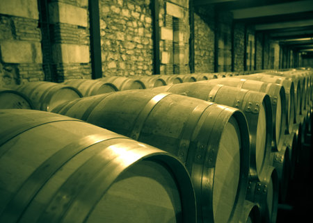 Aged photo of winery with  many wooden barrels in rows
