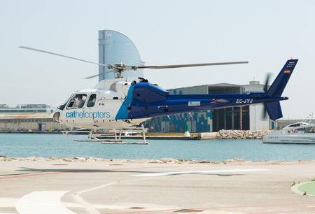BARCELONA, SPAIN - AUGUST 1, 2014: Flying helicopters of Helicopters tours company. Barcelona, Spainのeditorial素材
