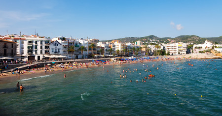 SITGES, SPAIN - AUGUST 6: Summer view of Sitges coast in August 6, 2013 in Sitges, Spain. It is known for its sandy beachのeditorial素材