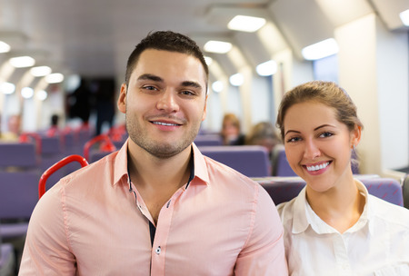 Smiling passenger travelling in comfortable trainの写真素材