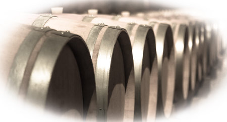 Aged image of old winemakers cellar with many barrelsの写真素材