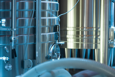 Closeup of interior  of contemporary winery with  stell barrelsの写真素材