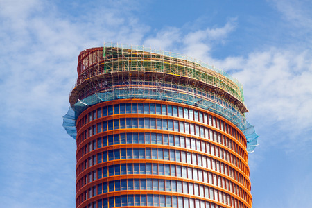 SEVILLE, SPAIN - NOVEMBER 19, 2014: Closeup of Cajasol Tower or  Pell Tower is an office skyscraper under construction in Seville, Spain.のeditorial素材