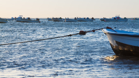 Fishing boats  lying at ocean bay.の写真素材