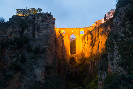 Ancient stone bridge  in twilight. Ronda,の写真素材